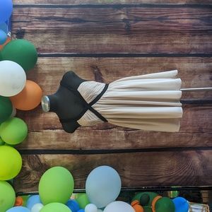 Size 6 cream dress with black trim from H&M.